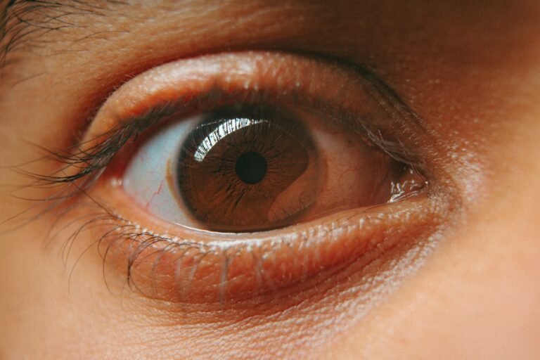 a close up of a person's brown eye