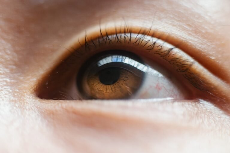 a close up of a person's brown eye