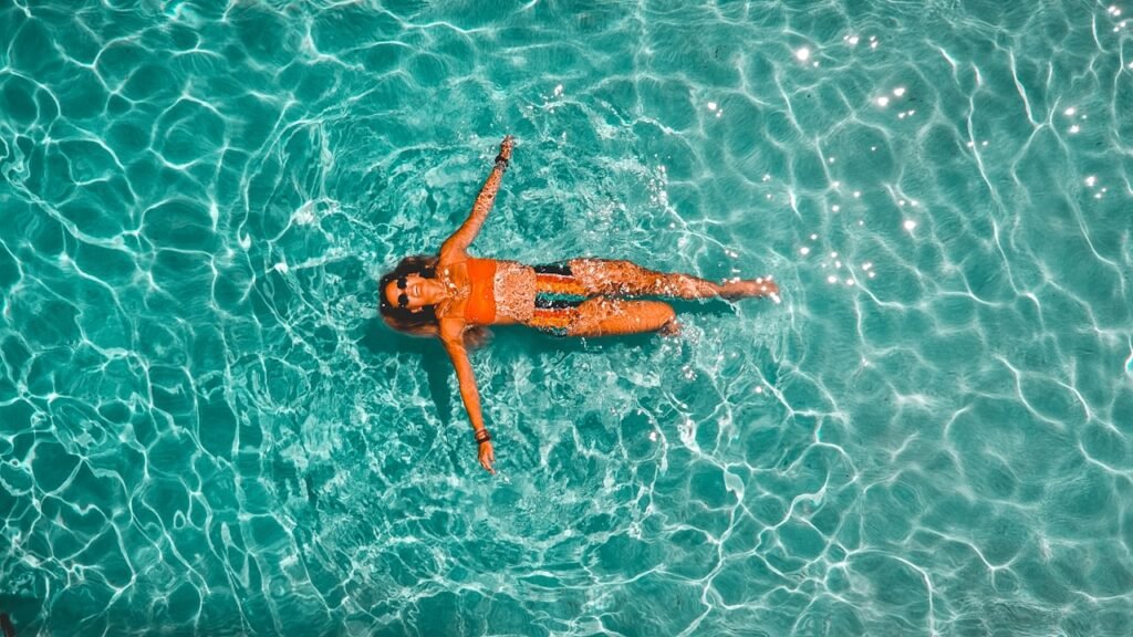 Older person at the edge of a swimming pool after cataract surgery