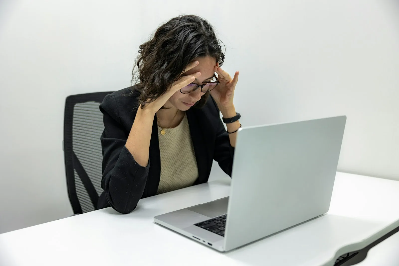 Tired woman in front of her laptop