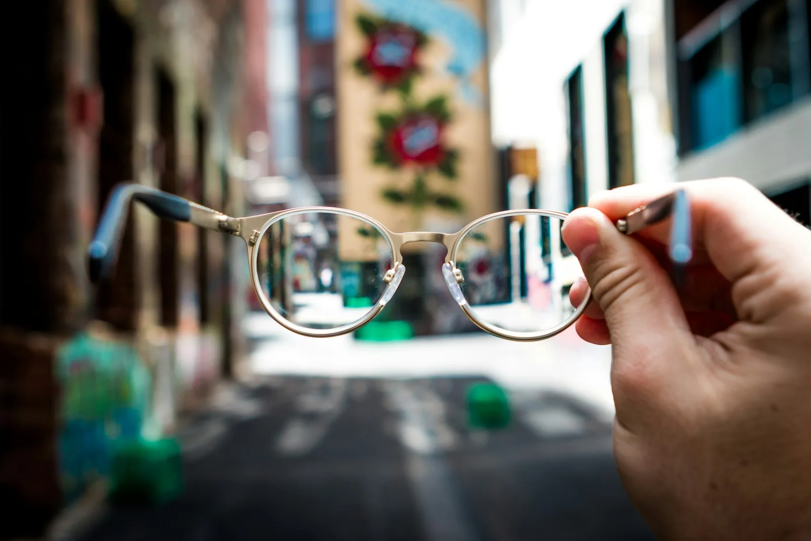 Pair of prescription glasses resting on a light surface